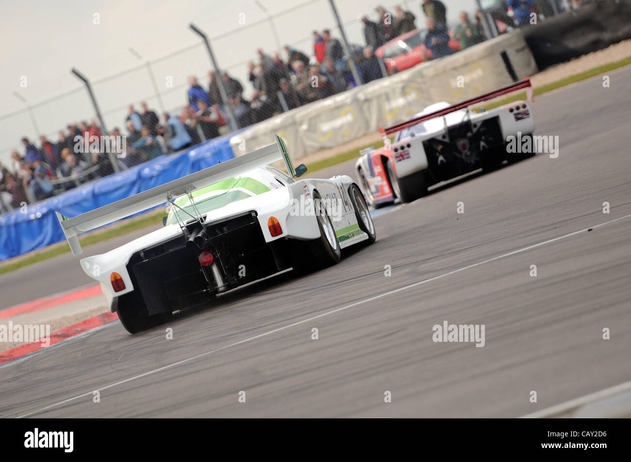 `6th May 2012, Donington Park Racing Circuit, UK.  The 1983 Jaguar XJR5B of Don Miles chases the Argo JM19C of Adrian Watt at the Donington Historic Festival. Stock Photo